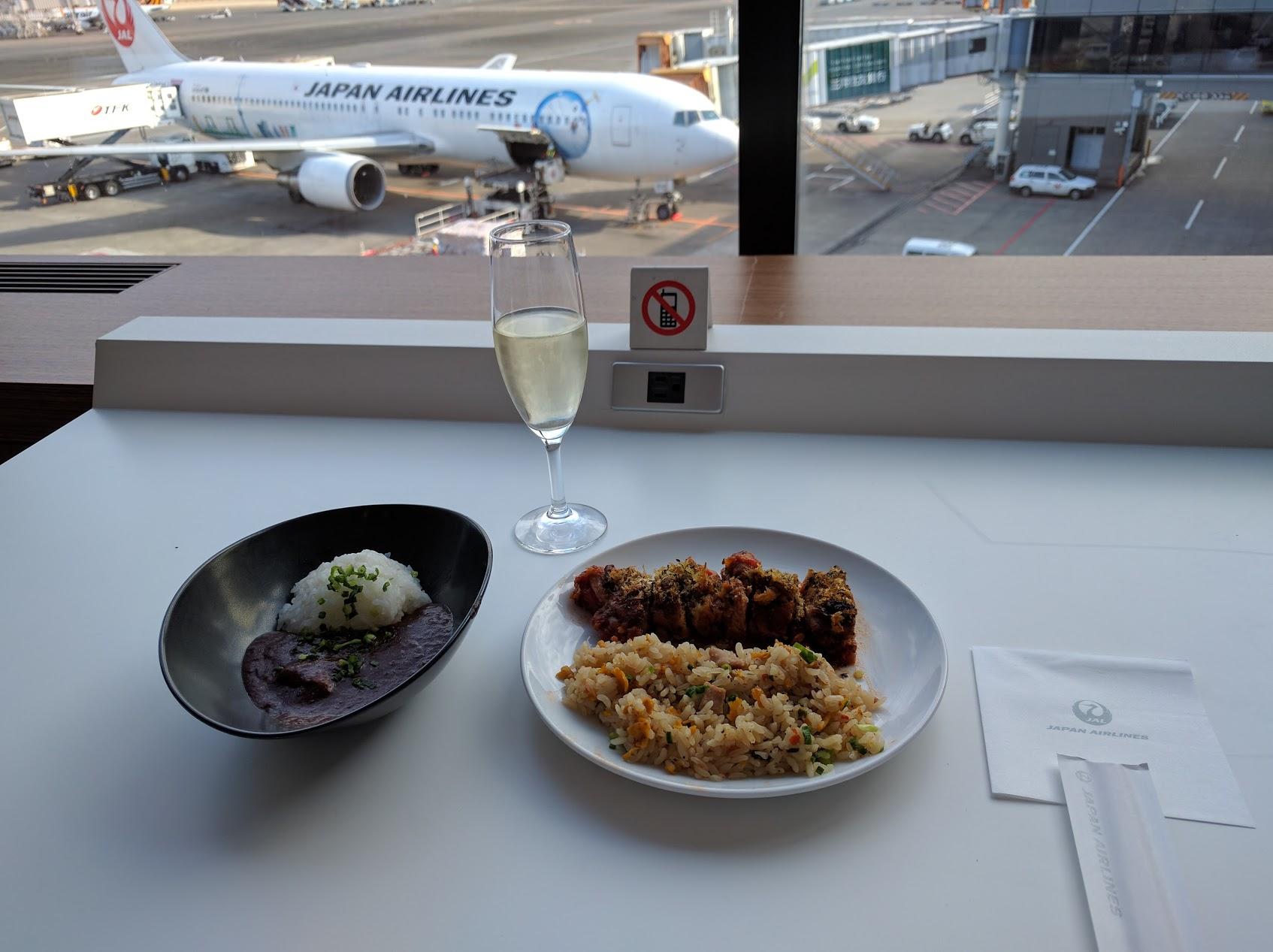 Lounge food with a view of JAL plane