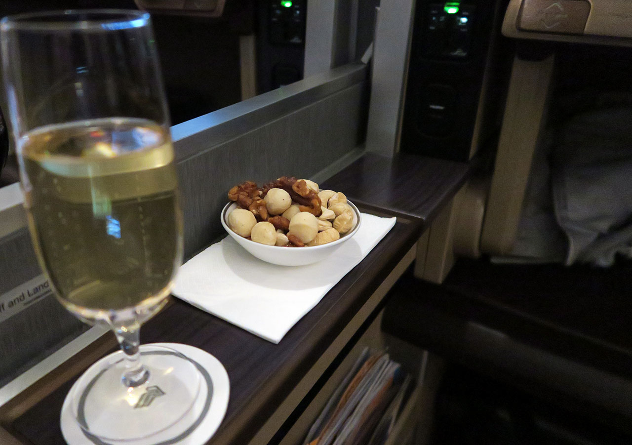 Singapore Airlines 777-300ER First Class wine and nuts