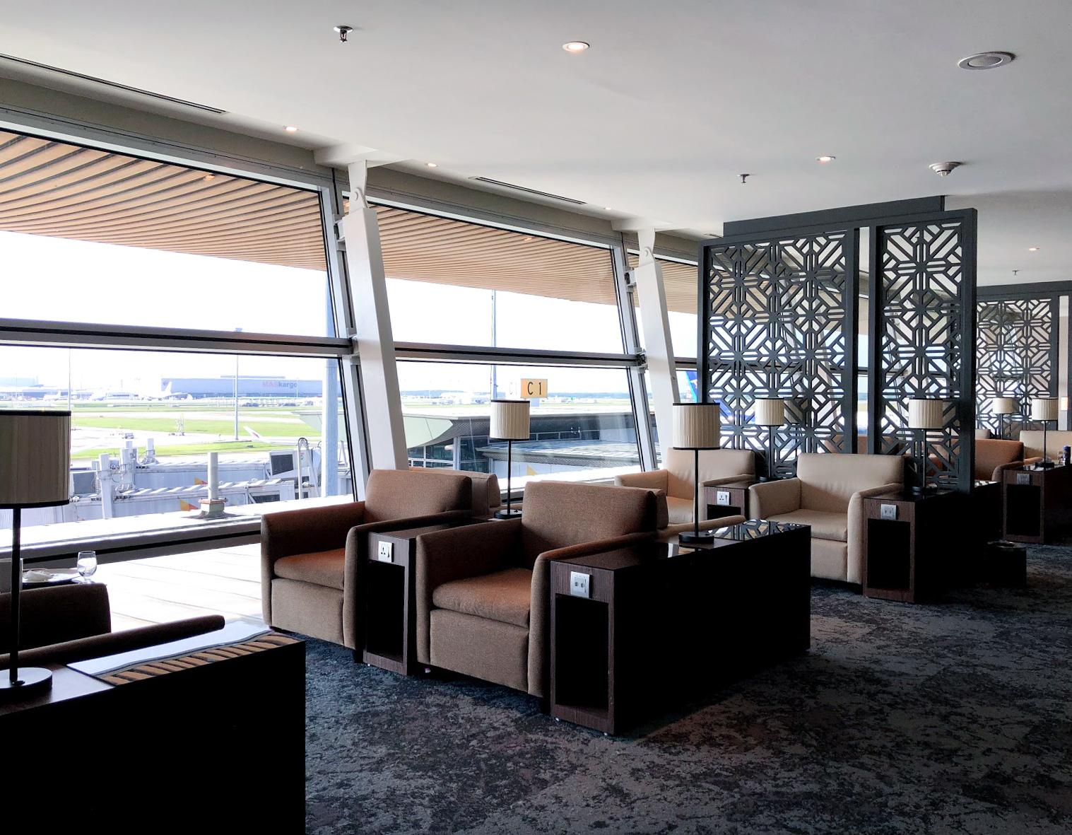 Malaysia Airlines Satellite Golden Lounge Kuala Lumpur seating area with tarmac view